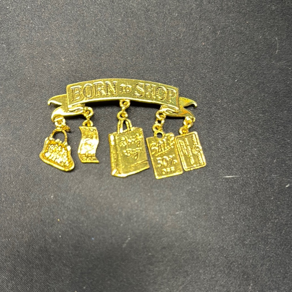Vintage 1986 JJ Jonette Gold Tone Born To Shop Charms Artifacts Brooch